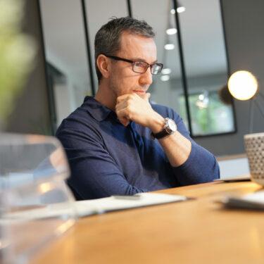 Middle-aged man having hot drink