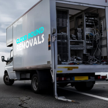 A van filled with legacy infrastructure driving towards the cloud.